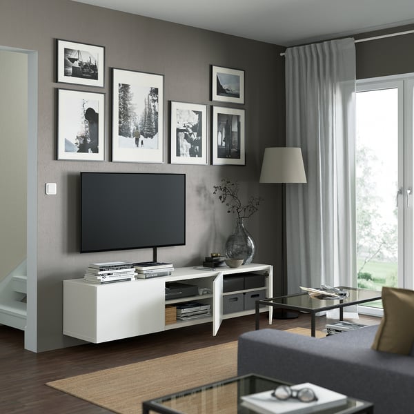 Modern living room with BESTÅ tv bench, adjustable shelves, and wall art.