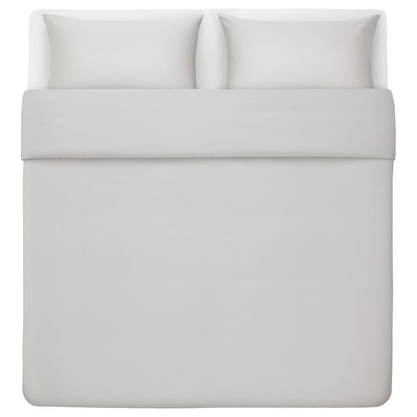 White bed in square shape with white bedding set, smooth texture, matching pillows.