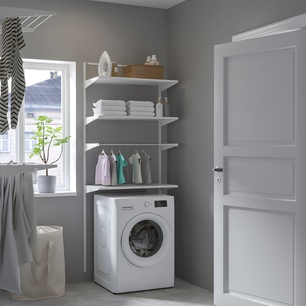BOAXEL laundry storage with towels, iron, washing machine, and plant.