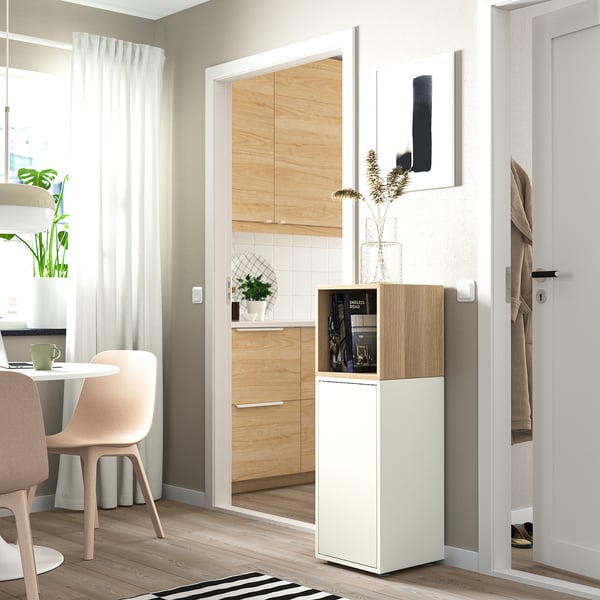 EKET storage unit with plants, near kitchen and dining area.