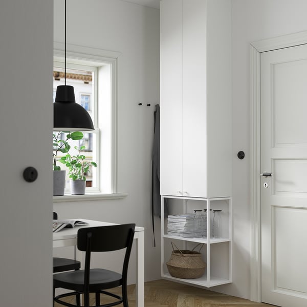 ENHET white storage cabinet with shelves, small, modern design, fit corner, next to desk, door, and window.