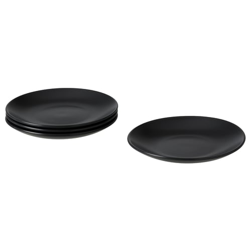 Image shows four black FÄRGKLAR ceramic plates, three stacked and one single, with a simple, round design.