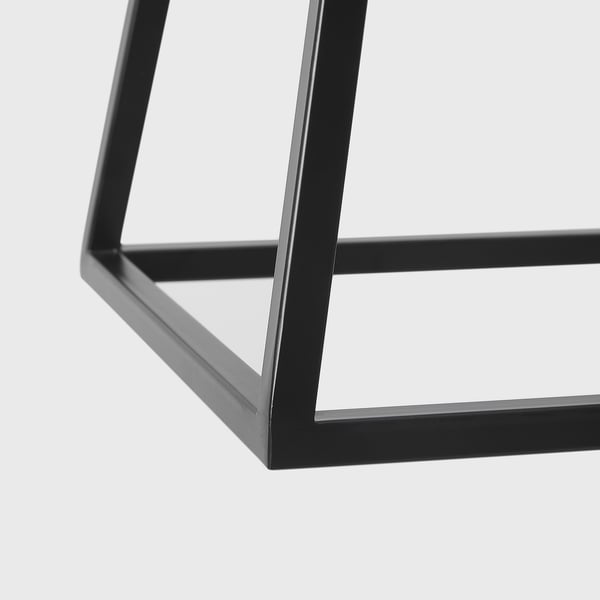 Black metal lamp with sleek, modern design; clean lines and minimalistic styling.