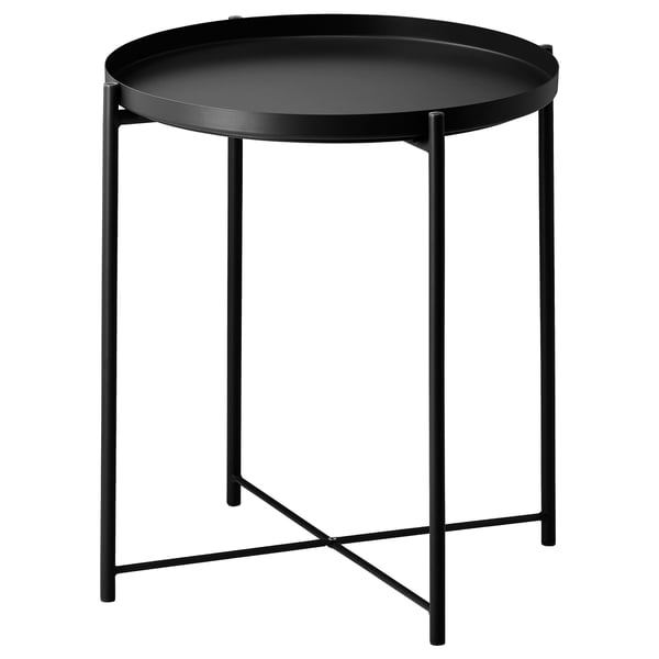 A black, circular GLADOM serving table with a removable tray, supported by a metal frame with crossed legs for stability.