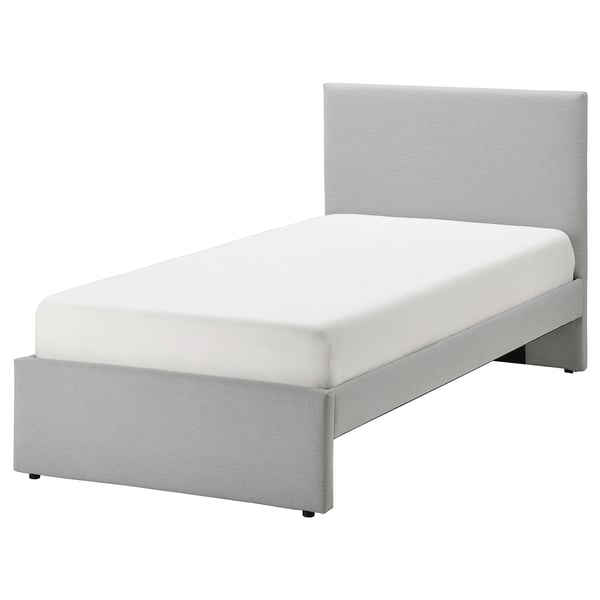 Modern grey upholstered bed with rectangular headboard and textured fabric, ideal for contemporary bedrooms.