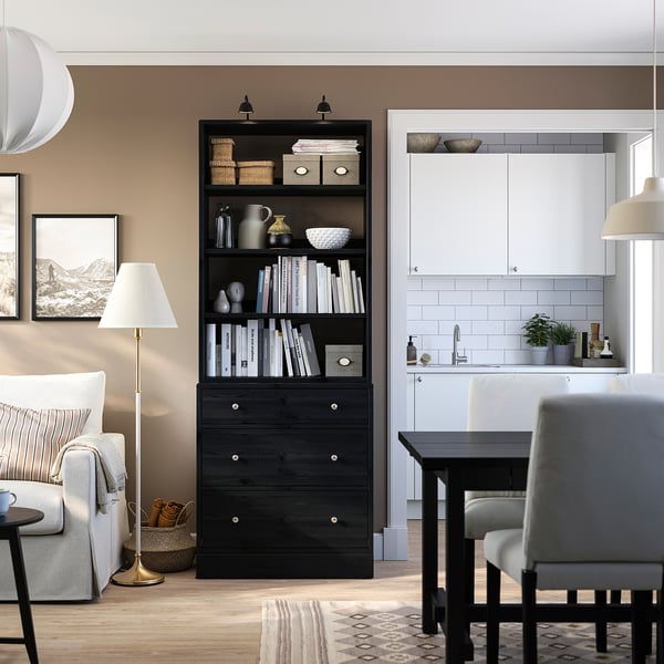 Black HAVSTA storage unit with shelves & drawers, blending scandinavian design & modern functionality, ideal for living & dining areas.