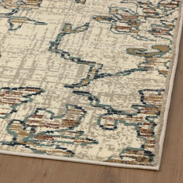 Soft, intricate floral rug on wooden floor, anti-stain, high quality, synthetic material.