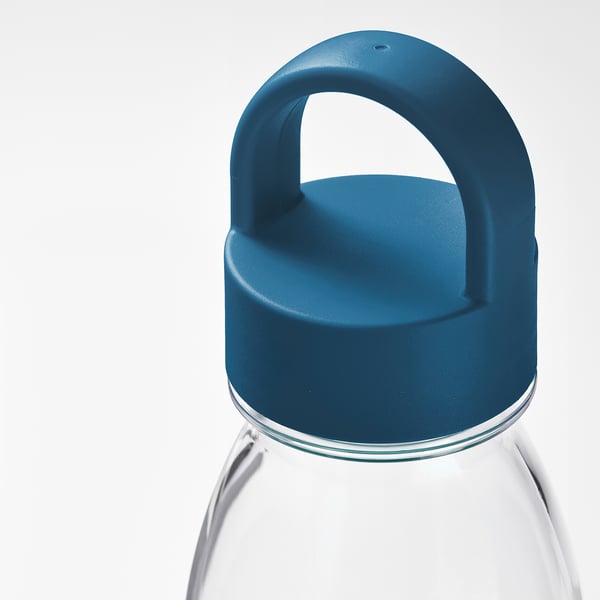 Clear water bottle with blue lid and handle, durable and easy to carry.