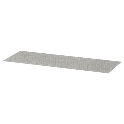 A grey KOMPLEMENT drawer mat, rectangular, made of polyester with a dotted surface design.