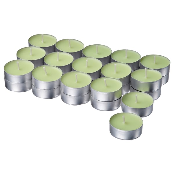 Collection of green candles in silver containers. Grouped in varying sizes, flat-topped with white wicks. Ideal for a fresh atmosphere.