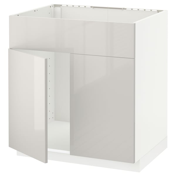 A white METOD kitchen cabinet with a glossy finish. The cabinet is rectangular, designed for a modern kitchen, with clean lines and a minimalist look.