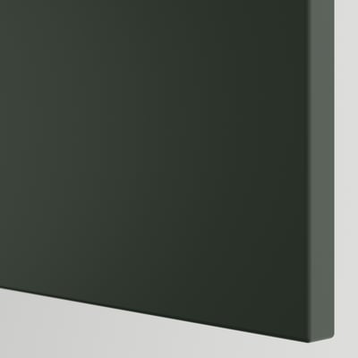 Dark green modern kitchen cabinet corner. Sleek, minimalist design with smooth surface.