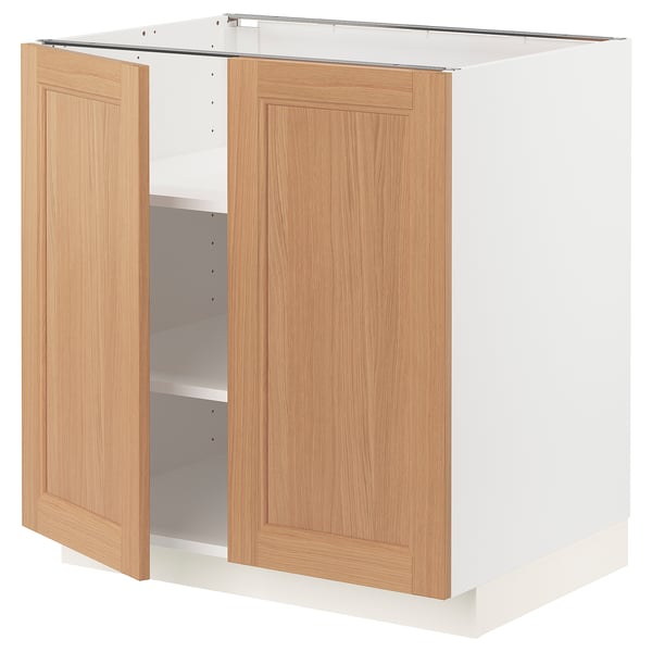 METOD kitchen cabinet in oak. Two open doors, white frame, square shape.