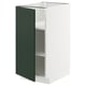 White METOD kitchen cabinet with green door, modern design.
