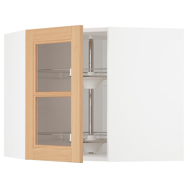 A white METOD kitchen corner cabinet with an open oak-framed glass door.