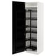 White METOD kitchen cabinet with black pull-out shelves, multiple storage levels, door slightly ajar.
