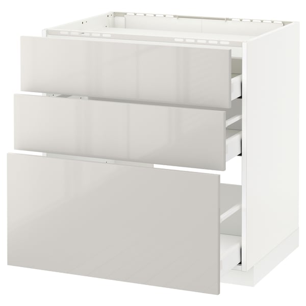White METOD kitchen unit with three high-gloss grey drawers.