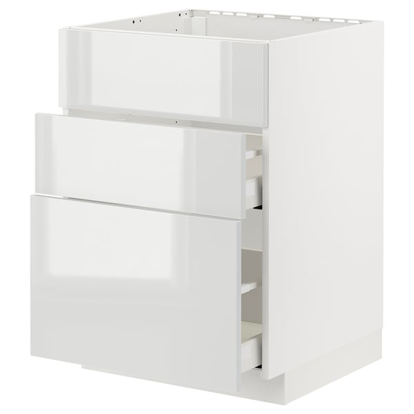 White METOD kitchen cabinet. Modern, glossy design with sleek drawers. High gloss finish, rectangular shape.