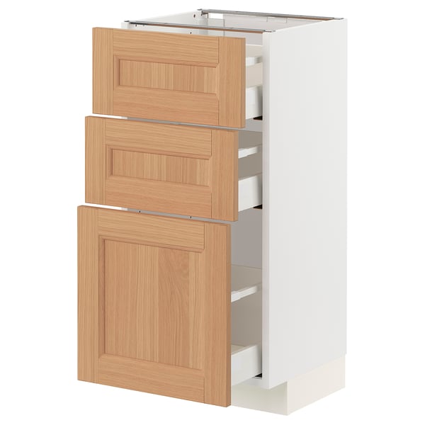 METOD kitchen cabinet with three oak drawers and door.