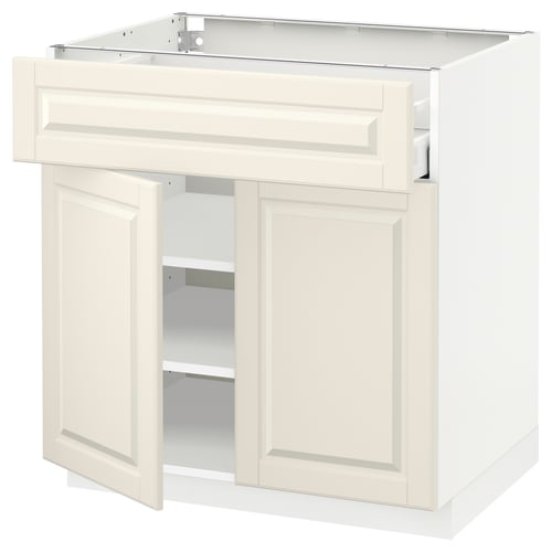 A white METOD kitchen cabinet with a traditional design, featuring off-white bodbyn fronts and bevelled edges.