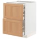 METOD kitchen unit with oak drawers and white base, modern design.
