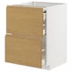 Modern white kitchen cabinet with light wood doors and minimalist design.
