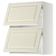 Image shows two white METOD kitchen cabinets with off-white bevelled doors.