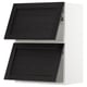Black wooden kitchen cabinet with two open doors, white frame.