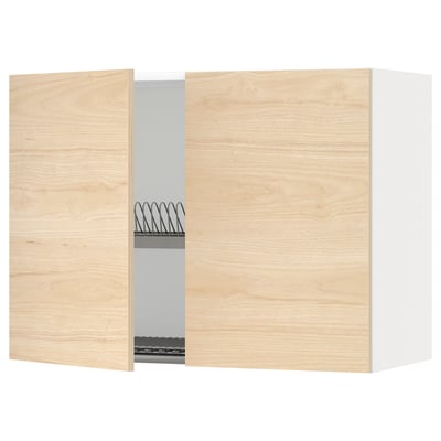 A light wood-colored kitchen cabinet with a wire dish drainer and a single open door, part of the METOD kitchen system.