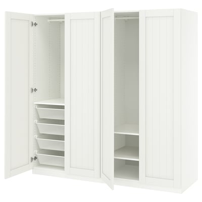 An open white ikea PAX wardrobe with shelves and mesh drawers.