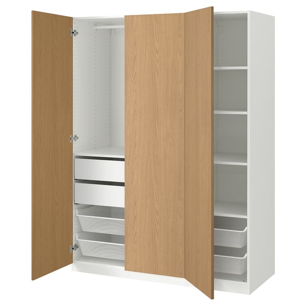 An open white PAX wardrobe with wooden doors, shelves, drawers, and mesh baskets.