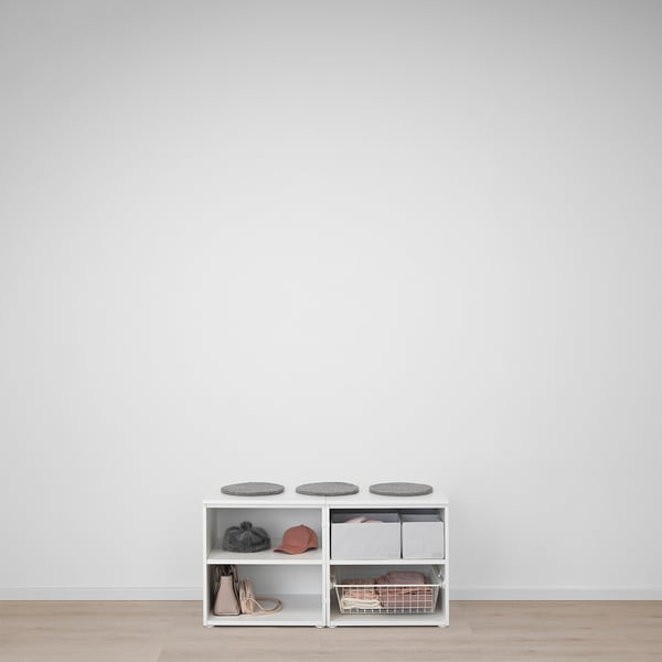 White PLATSA storage unit with grey cushions, red cap, black beanie, brown shoes, and wire basket.