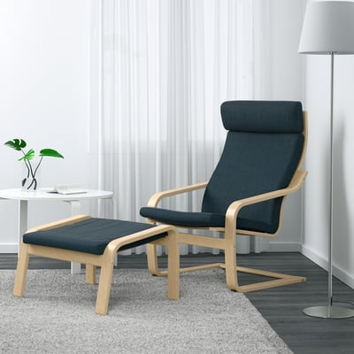 Blue POÄNG armchair & footstool, cosy design, tall lamp & plant nearby