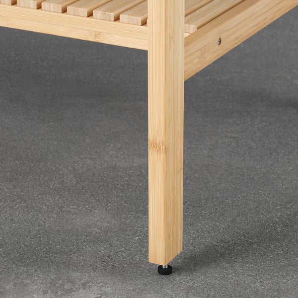 Natural bamboo shelf with adjustable feet for stability and protection, perfect for bathroom use.