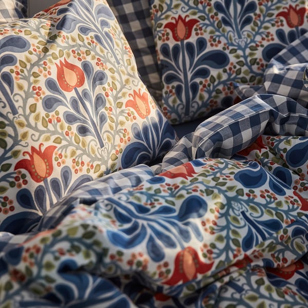 Floral patterned duvet cover set with chequered pillowcases, showcasing intricate design and high-quality, durable fabric.