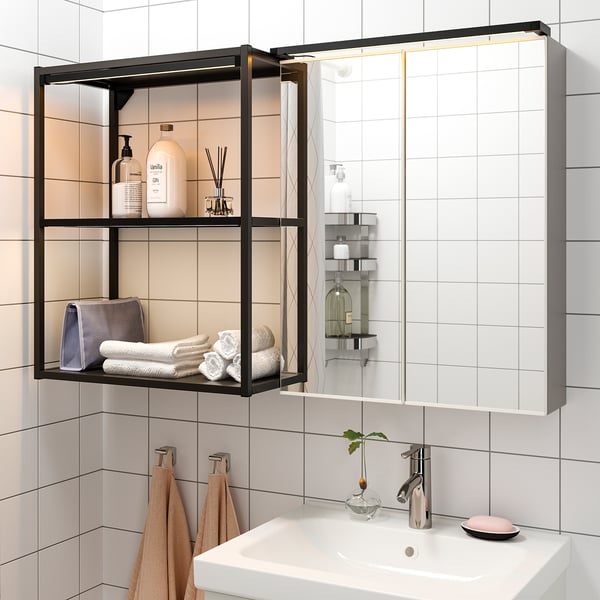 Modern bathroom with led-lit open shelves and sleek sink.