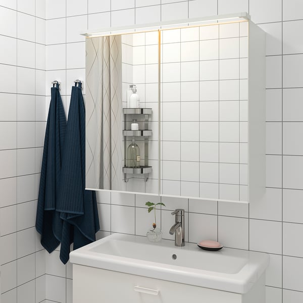 Modern bathroom sink with built-in led lighting under cabinet, providing functional task lighting and ambient atmosphere.