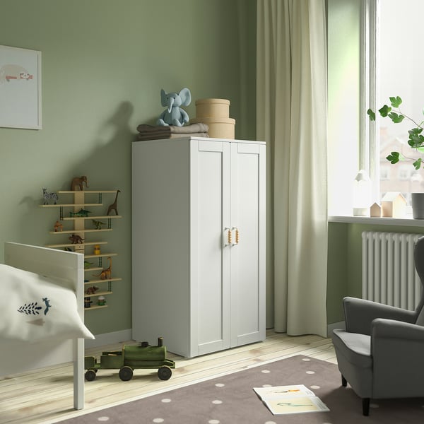 Kids room with white SMÅSTAD cabinet and wooden toys.