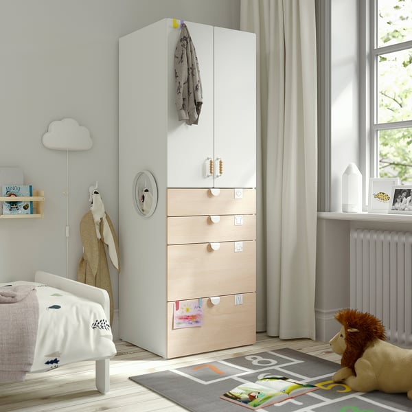 Kids room with SMÅSTAD wardrobe, bed, toys, books, and rug.