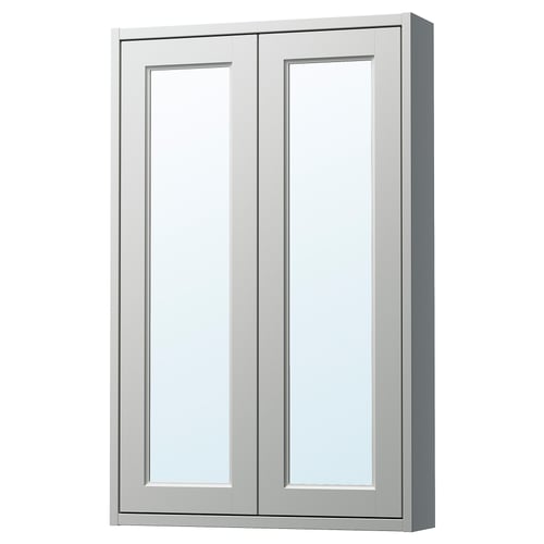 A TÄNNFORSEN light grey mirror wall cabinet with bevelled panels. It has a rectangular shape with two doors and a glass shelf inside.