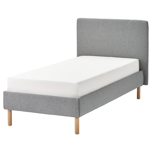 Modern grey upholstered bed, padded headboard, wooden legs.