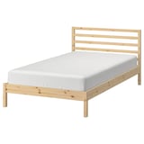 Natural wood TARVA bed frame with light grey mattress. Simple, scandinavian design.