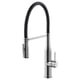 Modern chrome kitchen tap with pull-down sprayer.