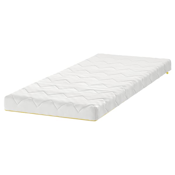 A white UNDERLIG junior mattress with a quilted surface. It is rectangular and a child-safe zip design.