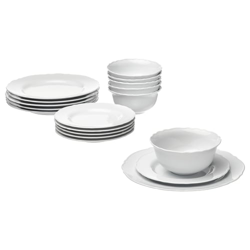 A set of white UPPLAGA porcelain dinnerware, including plates and bowls, with a rustic design and ruffled edges.
