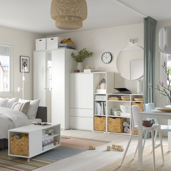 Modern nursery: VIHALS wardrobe, laptop station, toy baskets, natural decor.