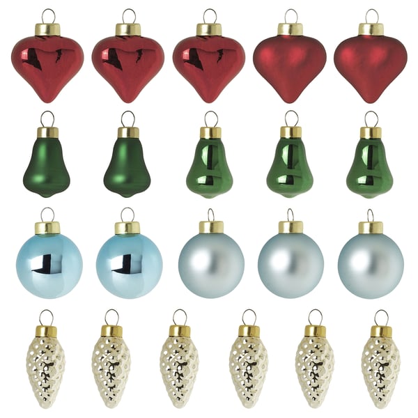 Colourful christmas ornaments in red, green, blue, and gold hues, featuring heart shapes, bells, and lightbulb designs, made of glass and aluminium.