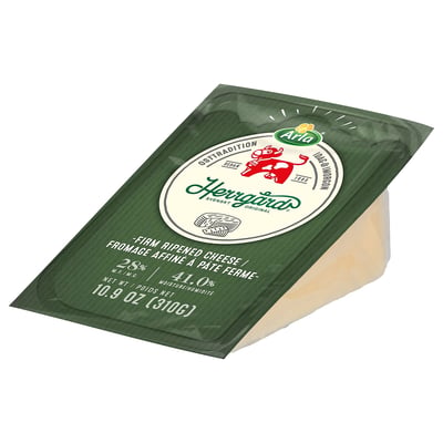 Das Bild zeigt ein abgepacktes Stück ARLA HERRGÅRD-Käse. Die grüne Verpackung zeigt Marken- und Produktinformationen an.