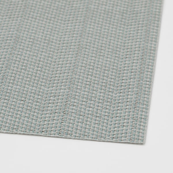Blau und weiß gewebtes Tischset aus Kunststoff, ordentlich gefaltet, mit kompliziertem Muster und sauberen Kanten.