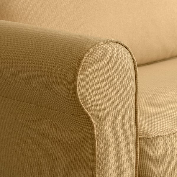 Ecke des beige Polsters auf dem Sofa, mit weichem Stoff und sauberer Nähte.
